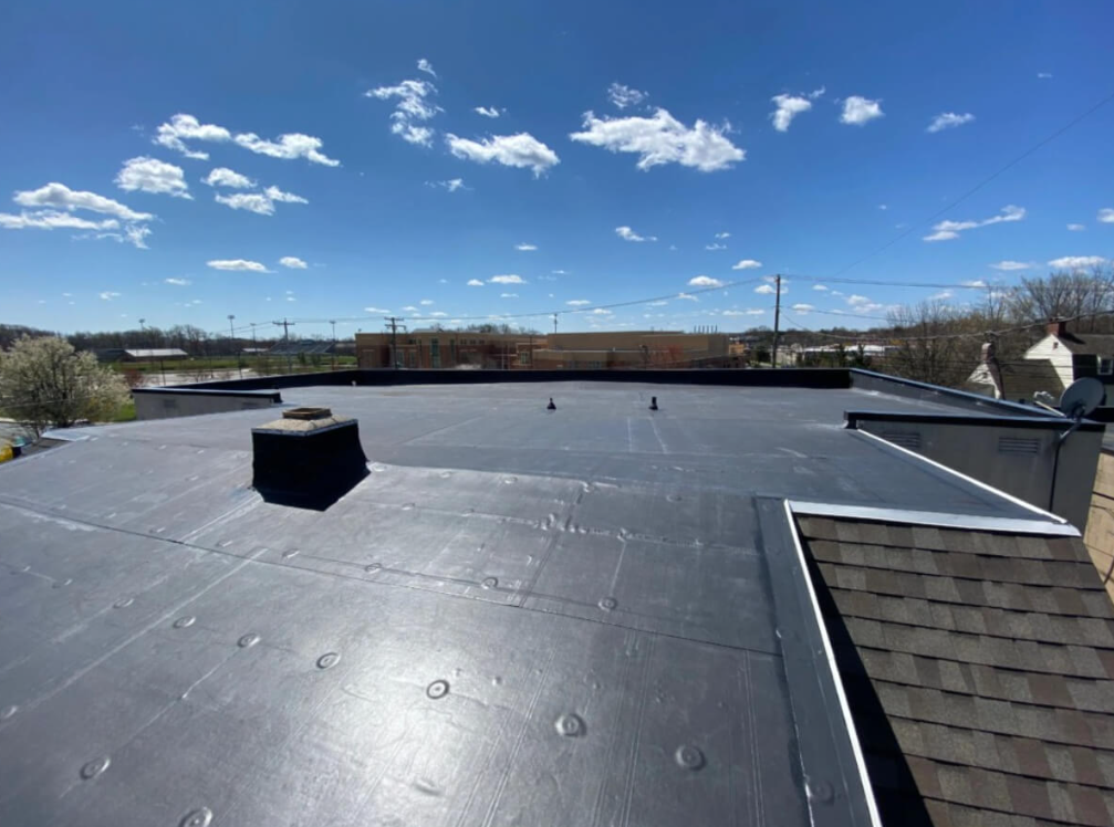Commercial flat membrane roof installation at a Castle Rock retail building