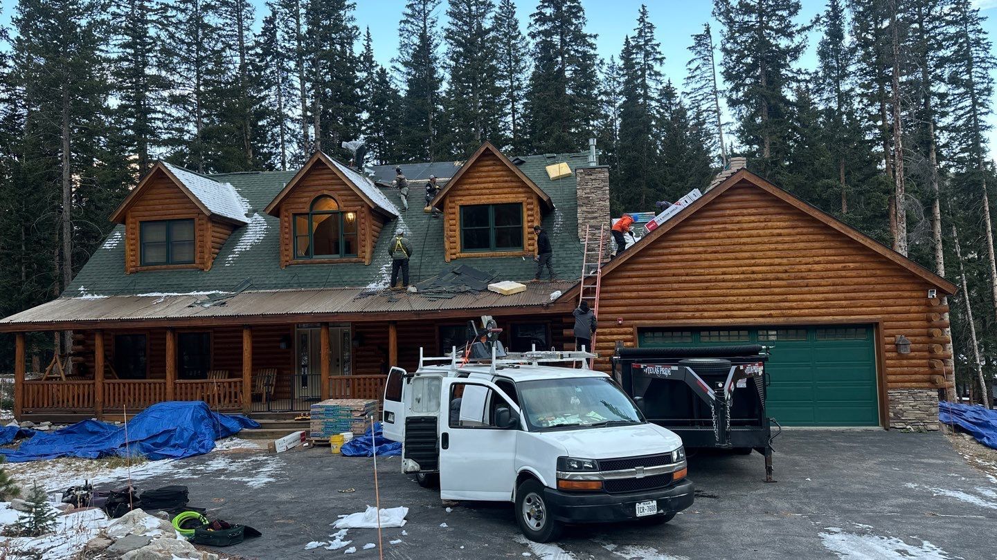 Force 5 Roofing crew replacing the roof on a log cabin in Summit County, Colorado